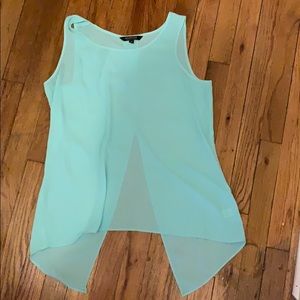 Sheer light blue tank with open slit in the back